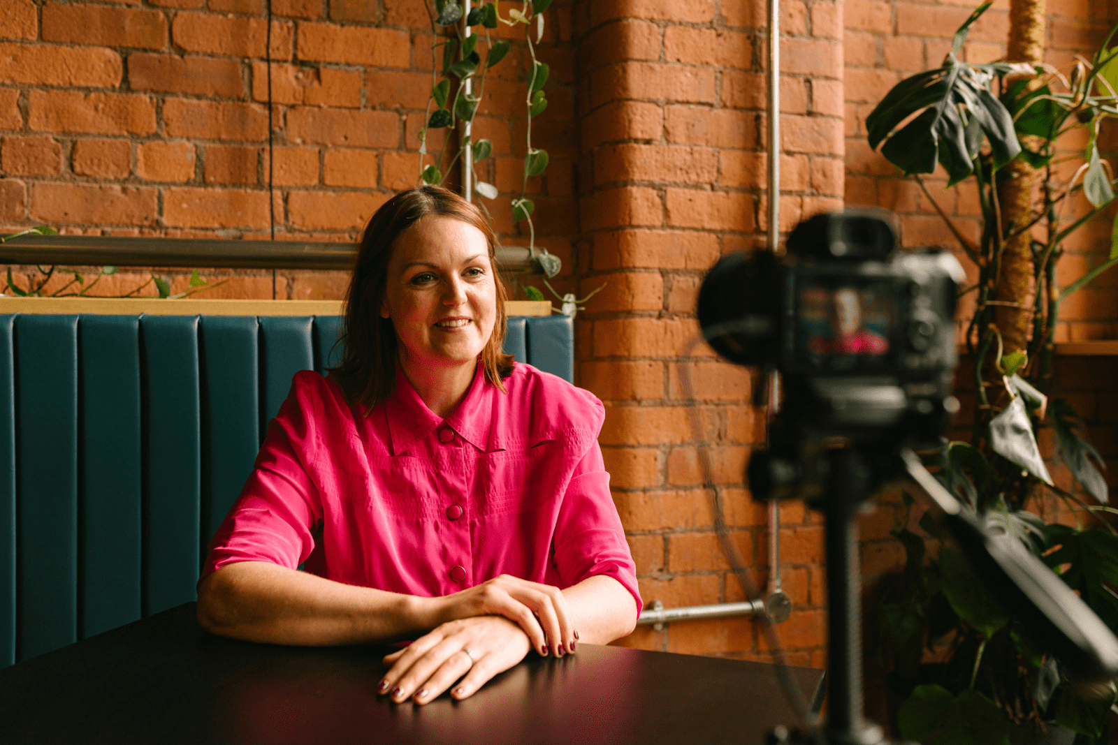 Victoria Moffatt sitting in front of camera for an interview